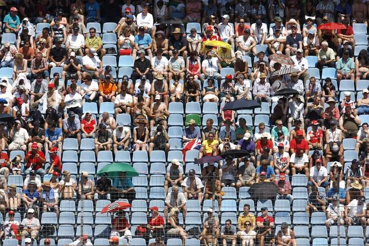 HOCKENHEIM, GERMANY - JULY 19: Fans watch the action during qualifying ahead of the German Grand Prix at Hockenheimring on July 19, 2014 in Hockenheim, Germany. (Photo by Drew Gibson/Getty Images)