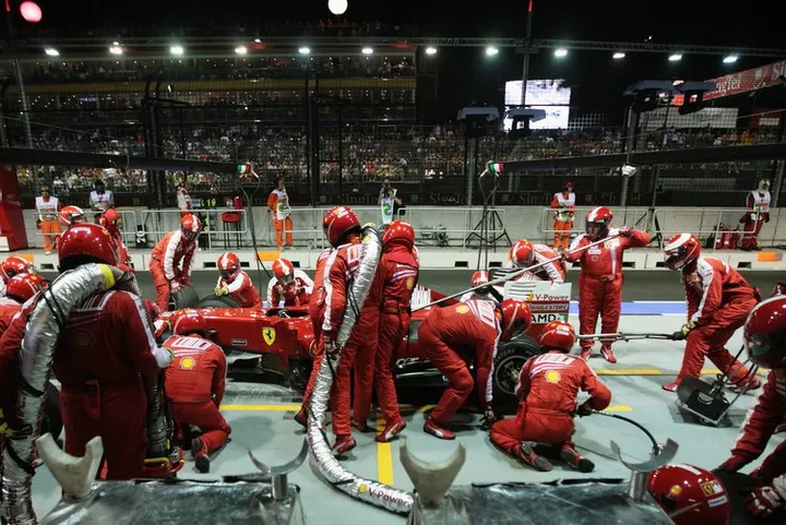 SINGAPORE - SEPTEMBER 27:  Ferrari refuelling team at work during the Singapore Formula One Grand Prix at the Marina Bay Street Circuit on September 27, 2009 in Singapore.  (Photo by Mark Thompson/Getty Images)