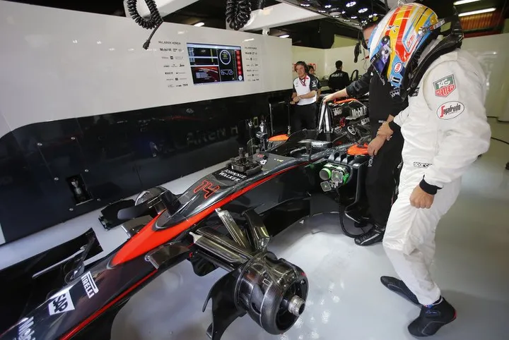 Fernando Alonso in the garage.