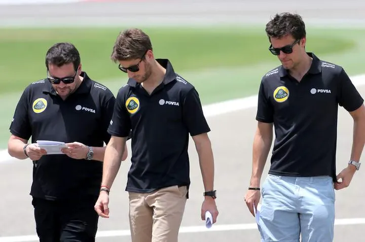 Romain Grosjean (FRA) Lotus F1 Team; and Jolyon Palmer 