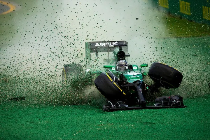 Kamui Kobayashi of Japan and Caterham gets off the track after his crash with Felipe Massa of Brazil and Williams during the Australian Formula One Grand Prix at Albert Park Circuit on March 16, 2014 in Melbourne, Australia. (Photo by Vladimir Rys)