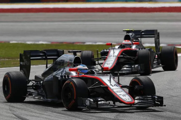 Fernando Alonso and Jenson Button.
