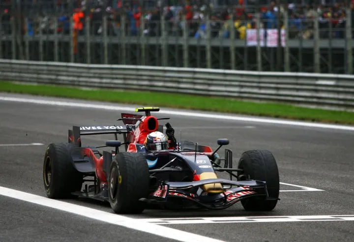MONZA, ITALY - SEPTEMBER 14: Sebastian Vettel of Germany and Scuderia Toro Rosso celebrates as he crosses the finish line to win the Italian Formula One Grand Prix at the Autodromo Nazionale di Monza on September 14, 2008 in Monza, Italy. (Photo by Paul Gilham/Getty Images) *** Local Caption *** Sebastian Vettel