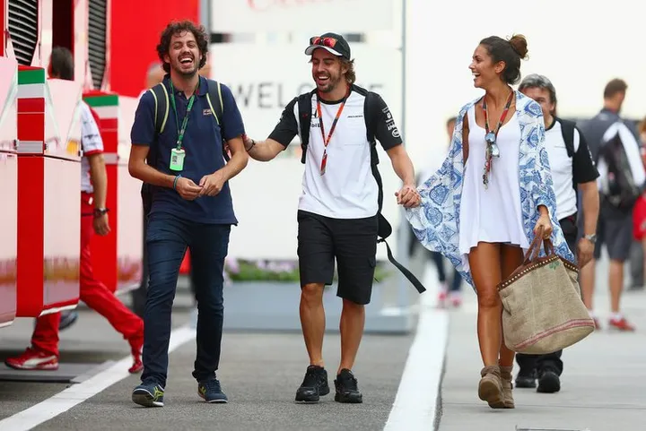 Fernando Alonso of Spain and McLaren Honda and his girlfriend Lara Alvarez walk in the paddock after qualifying for the Formula One Grand Prix of Hungary at Hungaroring on July 25, 2015 in Budapest, Hungary.