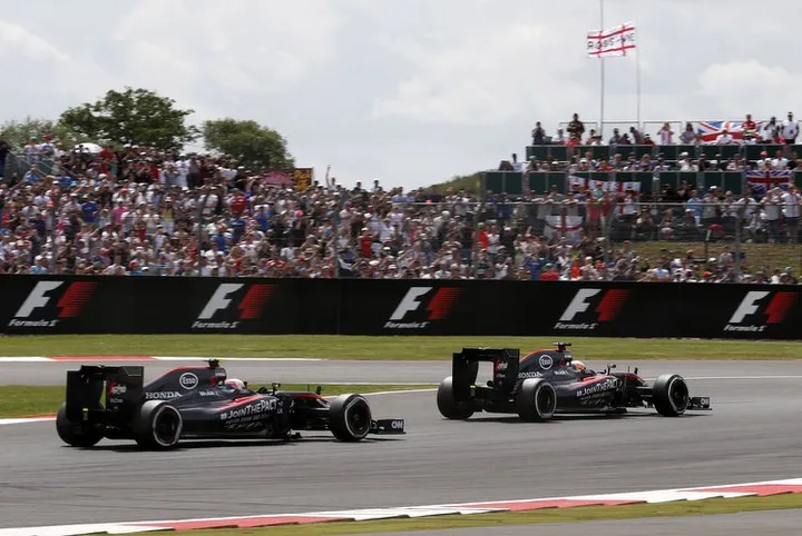 Fernando Alonso leads Jenson Button.