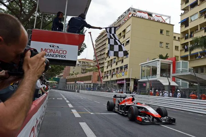 Jules Bianchi (FRA) Marussia F1 Team MR03 takes the chequered flag at the end of the race to score the team's first F1 points.25.05.2014. Formula 1 World Championship, Rd 6, Monaco Grand Prix, Monte Carlo, Monaco, Race Day.