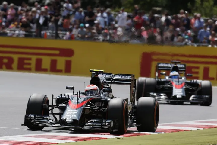 Jenson Button leads Fernando Alonso.