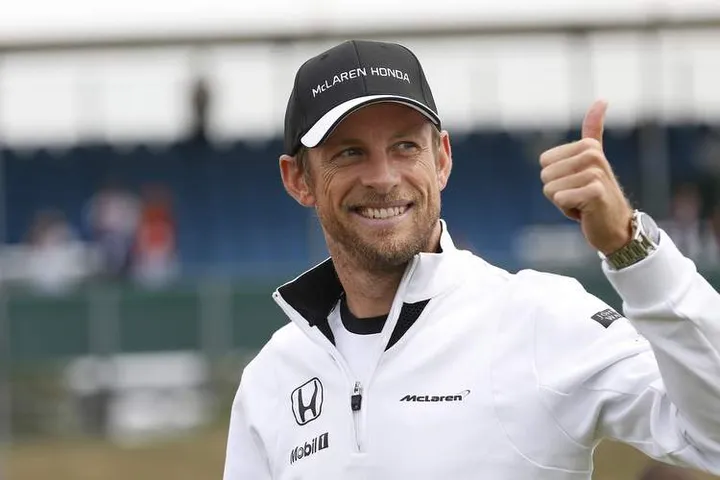 Jenson Button give a thumbs up.