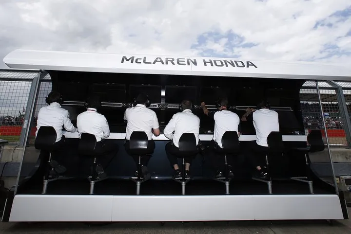 McLaren Honda The team at work on the pit wall.