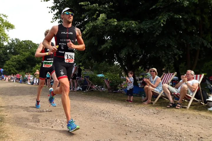 LUTON, ENGLAND - JULY 14:  Jenson Button competes in the The Jenson Button Trust Triathlon at Luton Hoo resort on July 14, 2013 in Luton, England.  (Photo by Clive Rose/Getty Images)