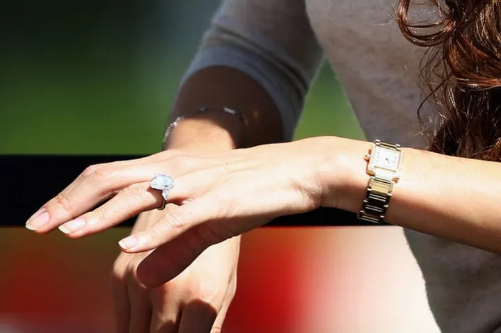 BAHRAIN, BAHRAIN - FEBRUARY 21:  Jessica Michibata (ring detail), girlfriend of Jenson Button of Great Britain and McLaren sits in the paddock during day three of Formula One Winter Testing at the Bahrain International Circuit on February 21, 2014 in Bahrain, Bahrain.  (Photo by Mark Thompson/Getty Images)
