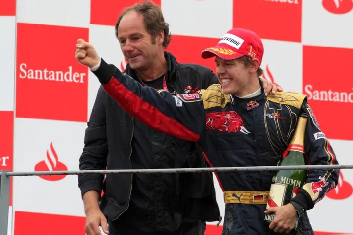 Sebastian Vettel (GER) Scuderia Toro Rosso celebrates on the podium with Gerhard Berger (AUT) Scuderia Toro Rosso Team Part Owner Formula One World Championship, Rd 14, Italian Grand Prix, Race, Monza, Italy, Sunday 14 September 2008.