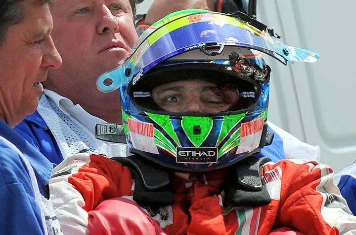 This handout picture by the Hungarian News Agency provided on July 25, 2009 shows Brazilian Formula One driver Felipe Massa of Scuderia Ferrari carried from his car after crashing during the qualifying session at the Hungaroring race track in Mogyorod near Budapest on July 25, 2009. The 28-year-old Brazilian - winner of 11 Grand Prix and the world championship runner-up in 2008 - came off at Turn Four after being struck by a piece of bodywork which had flown off the rear of compatriot Rubens Barrichello's Brawn car. Massa was airlifted to hospital and underwent surgery on his fractured skull. AFP PHOTO / HUNGARIAN NEWS AGENCY/TAMAS KOVACS (Photo credit should read TAMAS KOVACS/AFP/Getty Images)