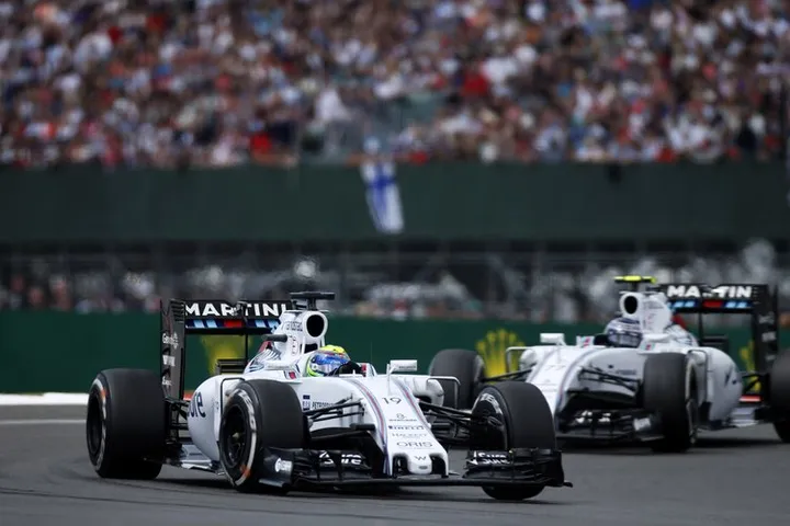 Silverstone, Northamptonshire, England. Sunday 5 July 2015. Felipe Massa, Williams FW37 Mercedes, leads Valtteri Bottas, Williams FW37 Mercedes. Photo: Glenn Dunbar/Williams ref: Digital Image WW2Q5592