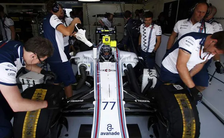 Hungaroring, Budapest, Hungary. Saturday 25 July 2015. Valtteri Bottas, Williams FW37 Mercedes, is prepared for the qualifying session in the garage. Photo: Glenn Dunbar/Williams ref: Digital Image WW2Q9104