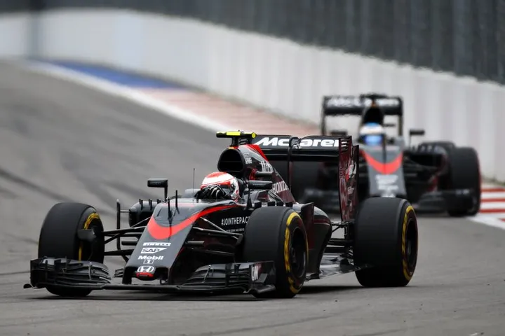 Jenson Button leads Fernando Alonso.