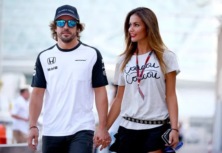 Fernando Alonso of Spain and McLaren Honda walks in the paddock with his girlfriend Lara Alvarez during previews for the Abu Dhabi Formula One Grand Prix at Yas Marina Circuit on November 26, 2015 in Abu Dhabi, United Arab Emirates.