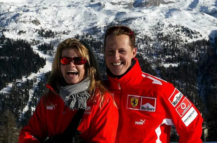 Ferrari's German driver Michael Schumacher and his wife Corinna smile as they arrive in the northern..