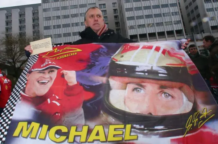 GRENOBLE, FRANCE - JANUARY 03: Fans gather outside the Grenoble University Hospital Centre to mark the 45th birthday of former German Formula One driver Michael Schumacher who is being treated for a severe head injury following a skiing accident on Sunday in Meribel on January 3, 2014 in Grenoble, France. (Photo by Alex Grimm/Bongarts/Getty Images)