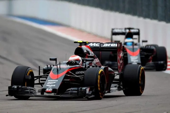 Jenson Button leads Fernando Alonso.