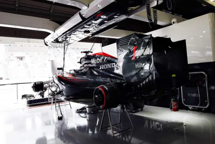 The McLaren Honda MP4-30 of Fernando Alonso in the garage.