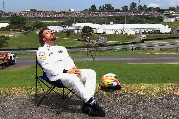 Alonso sitting in the sun Brazil McLaren Interlagos