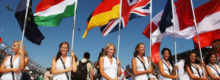 hi-res-80265825-grid-girls-hold-the-national-flags-of-all-of-drivers_crop_exact