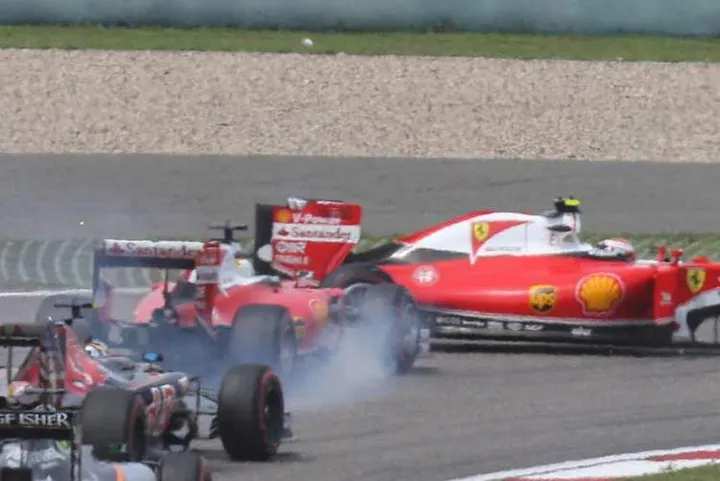 Sebastian Vettel (GER) Ferrari SF16-H and Kimi Raikkonen (FIN) Ferrari SF16-H make contact at the start of the race.