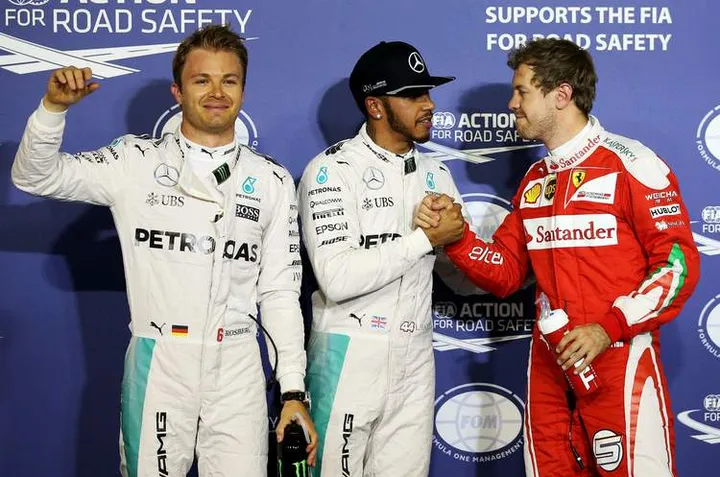 Lewis Hamilton of Great Britain and Mercedes GP, Nico Rosberg of Germany and Mercedes GP and Sebastian Vettel of Germany and Ferrari2