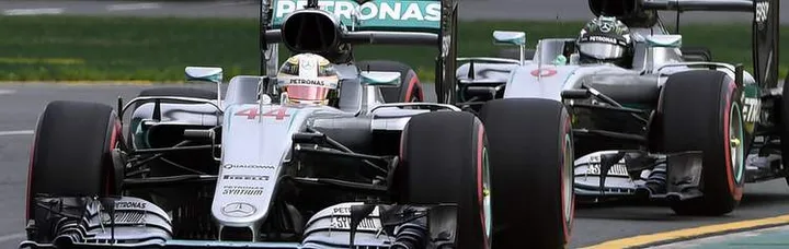 Lewis Hamilton leads team mate Nico Rosberg of Germany during qualifying
