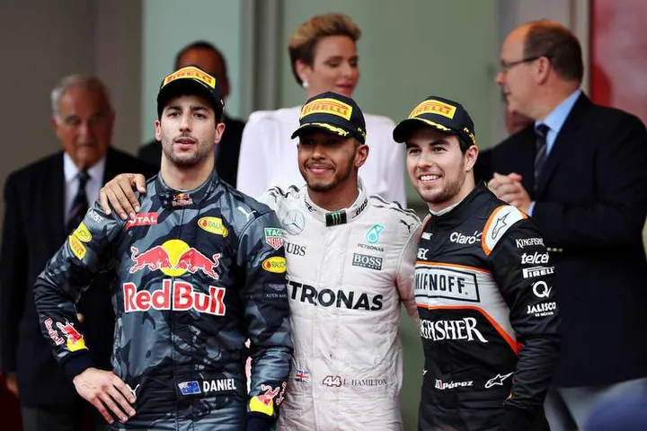 Top three finishers, Lewis Hamilton of Great Britain and Mercedes GP, Daniel Ricciardo