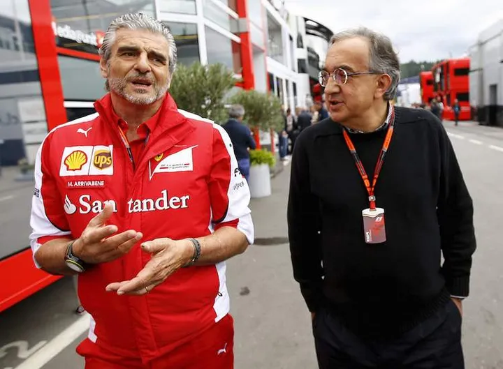 Ferrari Formula One team leader Maurizio Arrivabene (L) and Sergio Marchionne, CEO of Fiat Chrysler automobil arrive in the paddock before the start of the Austrian F1 Grand Prix at the Red Bull Ring circuit in Spielberg, Austria, June 21, 2015.  REUTERS/Leonhard Foeger