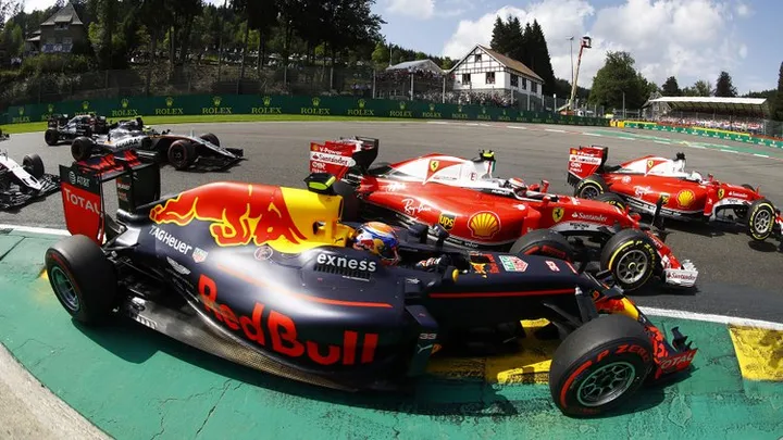 Spa-Francorchamps, Spa, Belgium.Sunday 28 August 2016.Max Verstappen, Red Bull Racing RB12 TAG Heuer, Kimi Raikkonen, Ferrari SF16-H and Sebastian Vettel, Ferrari SF16-H make contact at the start.World Copyright: Steven Tee/LAT Photographicref: Digital Image _O3I2132
