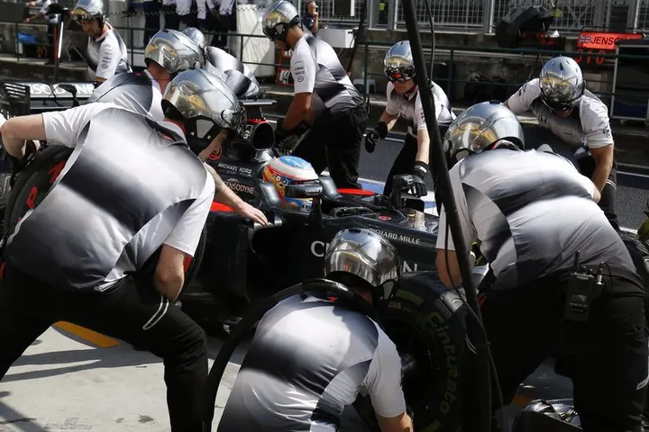 Fernando Alonso makes a pit stop.