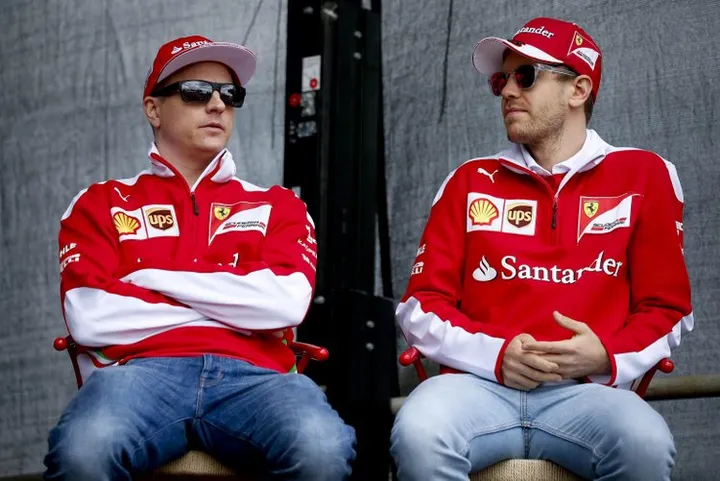epa05219939 Finnish Formula One driver Kimi Raikkonen (L) of Scuderia Ferrari and teammate German Formula One driver Sebastian Vettel take part in a promotional event at  the fan zone before qualifying at the Albert Park circuit for the Australian Formula One Grand Prix in Melbourne, Australia, 19 March 2016. The 2016 Formula One Grand Prix of Australia will take place on 20 March.  EPA/DIEGO AZUBEL