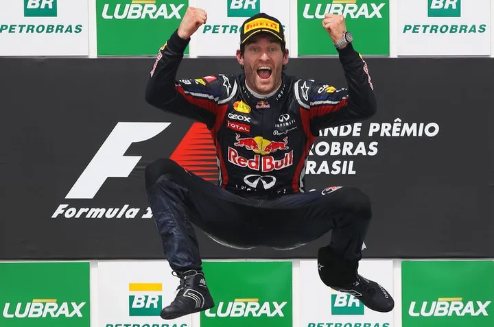 Mark Webber celebrates on the podium Formula 1