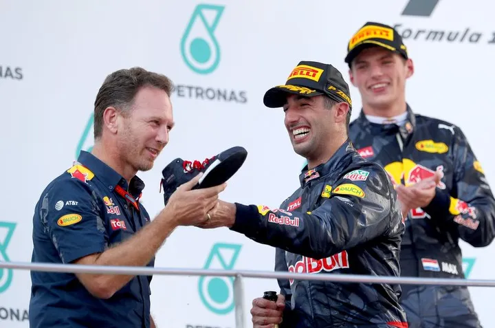 KUALA LUMPUR, MALAYSIA - OCTOBER 02:  Red Bull Racing Team Principal Christian Horner, Daniel Ricciardo of Australia and Red Bull Racing and Max Verstappen of Netherlands and Red Bull Racing celebrate on the podium during the Malaysia Formula One Grand Prix at Sepang Circuit on October 2, 2016 in Kuala Lumpur, Malaysia.  (Photo by Clive Rose/Getty Images) // Getty Images / Red Bull Content Pool  // P-20161002-01271 // Usage for editorial use only // Please go to www.redbullcontentpool.com for further information. //