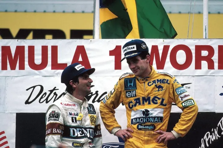 Left: Nelson Piquet (BRA) Williams FW11B, 2nd place; centre: Ayrton Senna (BRA) Lotus Honda T99, winner USA Grand Prix, Detroit, 21 June 1987