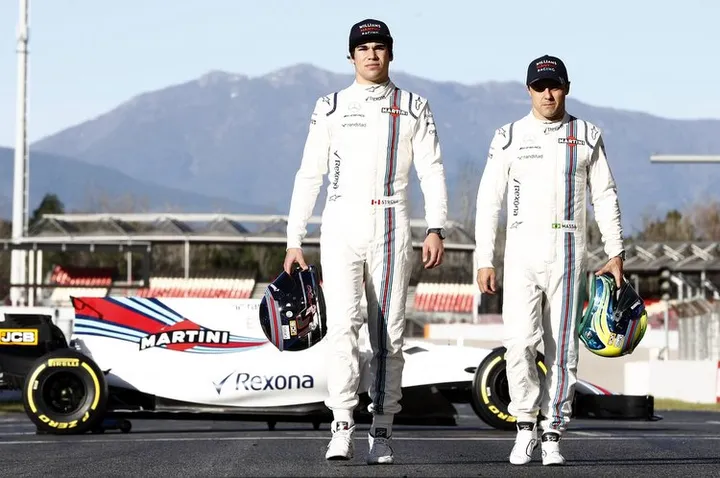 Williams Martini Racing Media Imagery. 2017 Formula 1 World Championship Preview. Lance Stroll and Felipe Massa pose with the Williams FW40 Mercedes at the Circuit de Catalunya, Barcelona, Spain. Copyright: Glenn Dunbar/Williams F1. Ref: _X4I3873