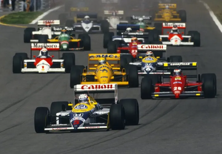 formula one Estoril, Portugal. 18-20 September 1987. Nigel Mansell (Williams FW11B Honda) leads Gerhard Berger (Ferrari F187) Ayrton Senna (Lotus 99T Honda), Nelson Piquet (Williams FW11B Honda) and Alain Prost (McLaren MP4/3 TAG Porsche) at the start, action. World Copyright: LAT Photographic Ref:87 POR 09.