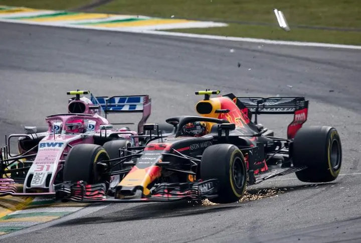 SAO PAULO, BRAZIL - NOVEMBER 11: Max Verstappen of the Netherlands driving the (33) Aston Martin Red Bull Racing RB14 TAG Heuer is crashed into by Esteban Ocon of France driving the (31) Sahara Force India F1 Team VJM11 Mercedes on track during the Formula One Grand Prix of Brazil at Autodromo Jose Carlos Pace on November 11, 2018 in Sao Paulo, Brazil. (Photo by Lars Baron/Getty Images) // Getty Images / Red Bull Content Pool // AP-1XFYXUEYW1W11 // Usage for editorial use only // Please go to www.redbullcontentpool.com for further information. //