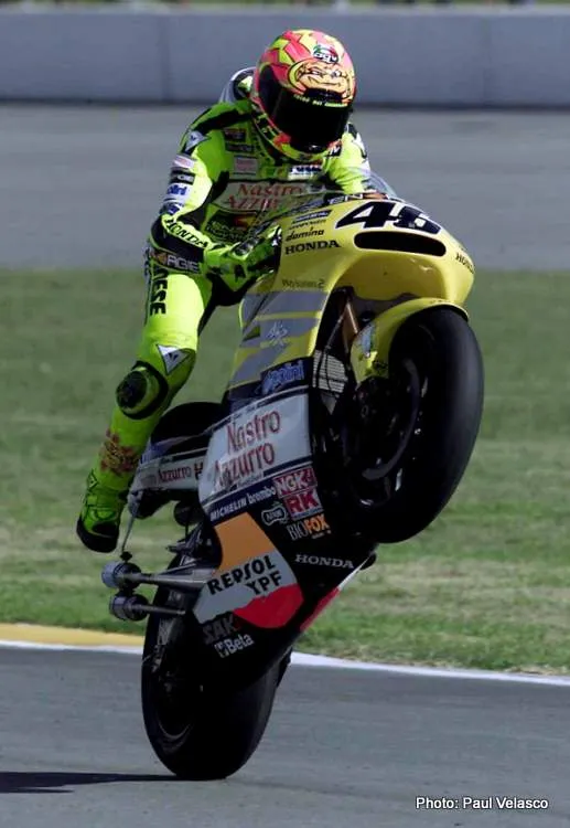 Italian rider Valentino Rossi does a wheelie after winning the South African Motorcycle 500cc Grand Prix at Phakisa Raceway in Welkom in the Free State Sunday 22 April 2001. It is the second win in a row of the season for Rossi who now leads the championship with 50 points. (Photo: Paul Velasco / PictureNET Africa) motorcycle sport