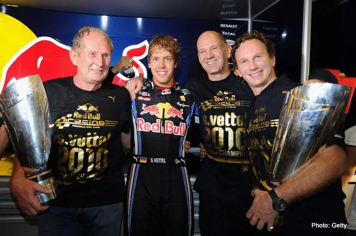 ABU DHABI, UNITED ARAB EMIRATES - NOVEMBER 14: Race winner and F1 2010 World Champion Sebastian Vettel (2nd left) of Germany and Red Bull Racing celebrates with Red Bull Racing Motorsport Consultant Dr Helmut Marko (left), Red Bull Racing Chief Technical Officer Adrian Newey (2nd right) and Red Bull Racing Team Principal Christian Horner (right) in their team garage following the Abu Dhabi Formula One Grand Prix at the Yas Marina Circuit on November 14, 2010 in Abu Dhabi, United Arab Emirates. (Photo by Clive Mason/Getty Images) *** Local Caption *** Sebastian Vettel; Christian Horner; Adrian Newey; Helmut Marko