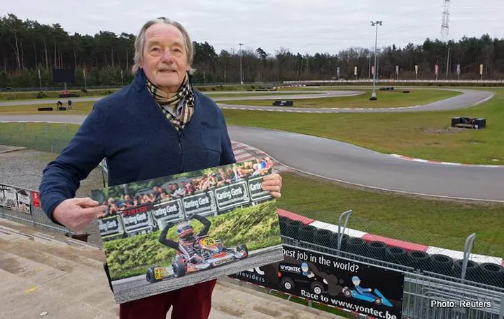 Paul Lemmens, owner of karting circuit "Karting Genk", where Formula One World Champion Red Bull's Max Verstappen started his racing career, holds a signed photograph of Verstappen in Genk in 2018, as he poses during an interview with Reuters in Genk, Belgium, December 13, 2021. REUTERS/Clement Rossignol