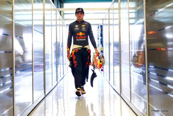 ABU DHABI, UNITED ARAB EMIRATES - DECEMBER 14: Max Verstappen of Netherlands and Red Bull Racing walks into the garage during Formula 1 testing at Yas Marina Circuit on December 14, 2021 in Abu Dhabi, United Arab Emirates. (Photo by Clive Rose/Getty Images)