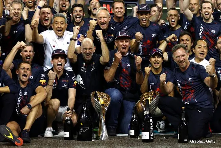 ABU DHABI, UNITED ARAB EMIRATES - DECEMBER 12: Race winner and 2021 F1 World Drivers Champion Max Verstappen of Netherlands and Red Bull Racing celebrates with his team after the F1 Grand Prix of Abu Dhabi at Yas Marina Circuit on December 12, 2021 in Abu Dhabi, United Arab Emirates. (Photo by Bryn Lennon/Getty Images)