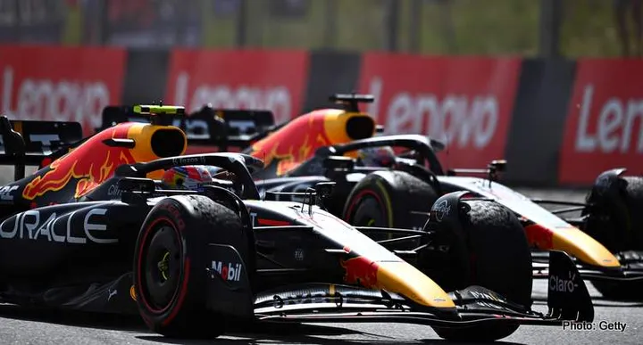 BARCELONA, SPAIN - MAY 22: Race winner Max Verstappen of the Netherlands driving the (1) Oracle Red Bull Racing RB18 and Second placed Sergio Perez of Mexico driving the (11) Oracle Red Bull Racing RB18 on the slow down lap during the F1 Grand Prix of Spain at Circuit de Barcelona-Catalunya on May 22, 2022 in Barcelona, Spain. (Photo by Clive Mason/Getty Images)