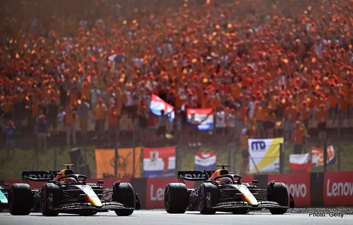 BARCELONA, SPAIN - MAY 22: Race winner Max Verstappen of the Netherlands driving the (1) Oracle Red Bull Racing RB18 and Second placed Sergio Perez of Mexico driving the (11) Oracle Red Bull Racing RB18 on the slow down lap during the F1 Grand Prix of Spain at Circuit de Barcelona-Catalunya on May 22, 2022 in Barcelona, Spain. (Photo by Clive Mason/Getty Images)