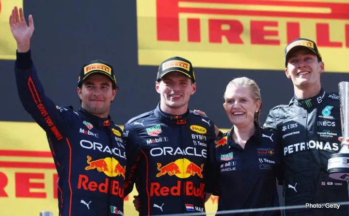 BARCELONA, SPAIN - MAY 22: Race winner Max Verstappen of the Netherlands and Oracle Red Bull Racing, Second placed Sergio Perez of Mexico and Oracle Red Bull Racing and Third placed George Russell of Great Britain and Mercedes celebrate on the podium during the F1 Grand Prix of Spain at Circuit de Barcelona-Catalunya on May 22, 2022 in Barcelona, Spain. (Photo by Mark Thompson/Getty Images)