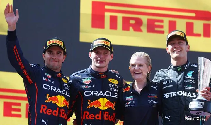 BARCELONA, SPAIN - MAY 22: Race winner Max Verstappen of the Netherlands and Oracle Red Bull Racing, Second placed Sergio Perez of Mexico and Oracle Red Bull Racing and Third placed George Russell of Great Britain and Mercedes celebrate on the podium during the F1 Grand Prix of Spain at Circuit de Barcelona-Catalunya on May 22, 2022 in Barcelona, Spain. (Photo by Mark Thompson/Getty Images)